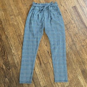 Plaid stretch pants with tie belt.
